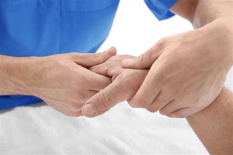 Premium Photo Physiotherapist Giving Hand Massage To Senior Patient