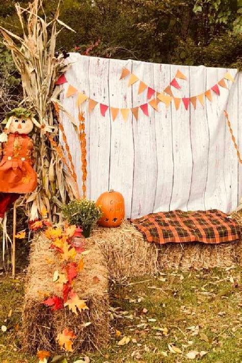 Fall Harvest Inspired Photo Booth Props With Haystacks And A Scarecrow