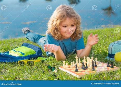 Chess Game For Kids Child Playing Chess Outdoor In Park Stock Photo