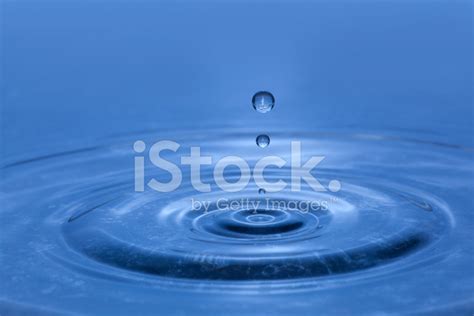 Dripping Water Droplets Splash On Blue Pond Surface Rippling Ou Stock