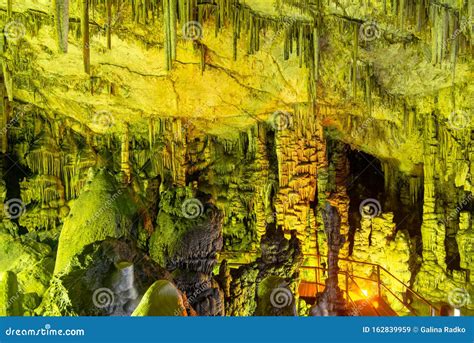 Cave Rock Formations Are Stalactites And Stalagmites In Colorful Light