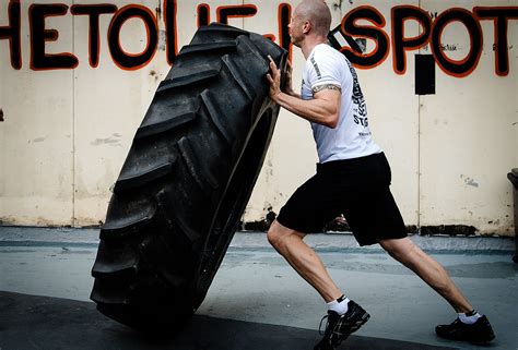 Crossfit Man Doing Tyre Flipping Exercise
