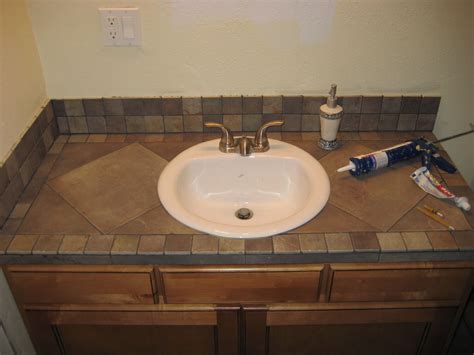 Tile has always been a popular material for bathroom countertops, but homeowners often complain. Bathroom vanity tile countertop | My projects | Pinterest