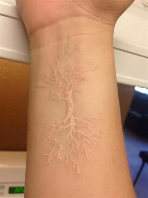 White Inked Tree Tattoo With Roots Skin Color