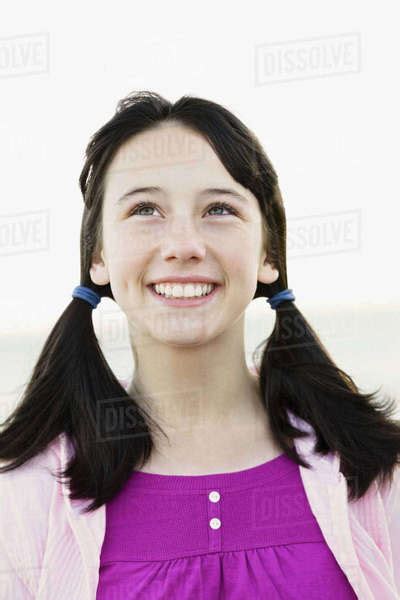 Young Girl With Ponytails Stock Photo Dissolve
