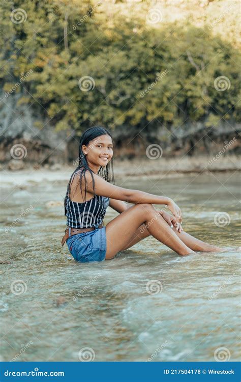 Portrait Of A Beauitful Brown Skin Filipina Model On A White Sand Beach