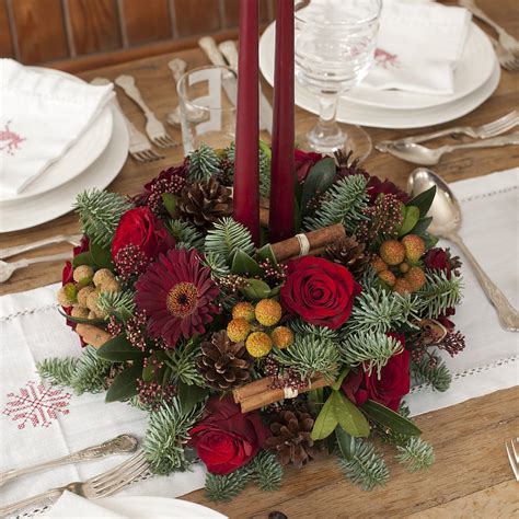 christmas fresh fir and flower centrepiece by the flower studio