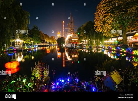 The Lake At Tivoli Gardens At Night In Copenhagen Denmark Stock Photo