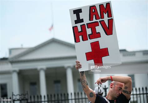 Hiv Patient Aaron Laxton Of St Louis Missouri Holds Up A Sign In