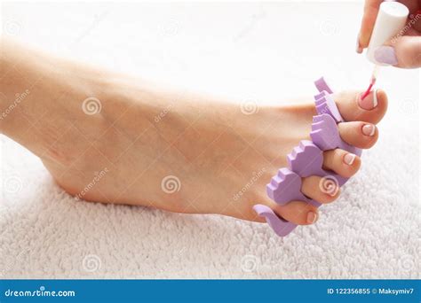 Close Up Photo Of A Female Feet At Spa Salon On Pedicure Procedure