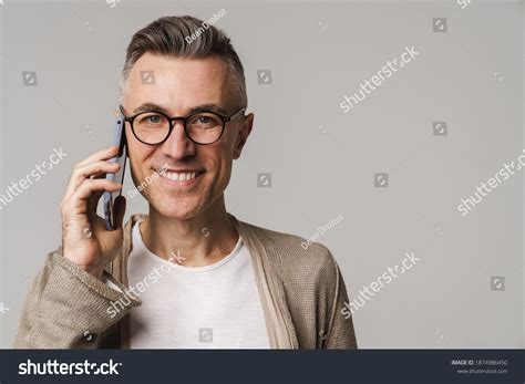 Smiling Attractive Smart Looking Man Using Stock Photo 1874986450