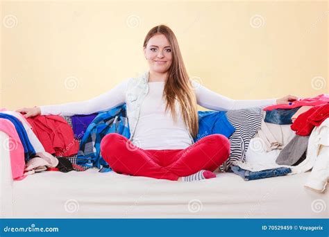 Happy Woman Sitting On Sofa In Messy Room At Home Stock Image Image