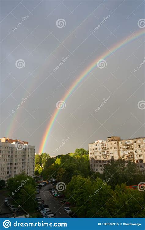 General View Of A Large Bright Double Rainbow Over The
