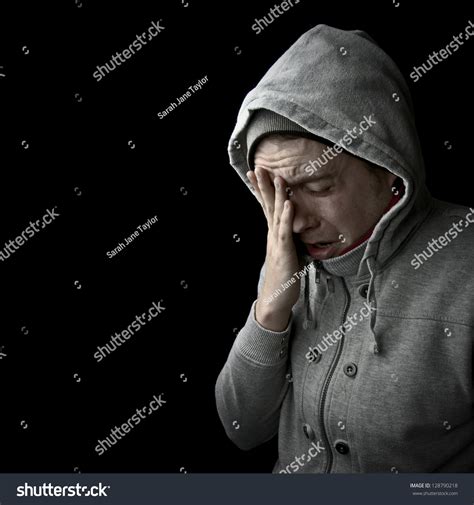 Man Hooded Jacket Holding Forehead Hand Stock Photo 128790218