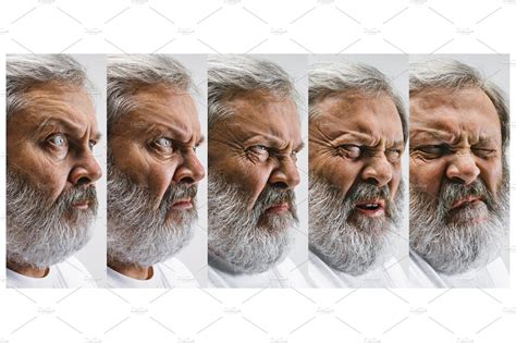 Senior Man With Disgusted Expression Repulsing Something On White Stock