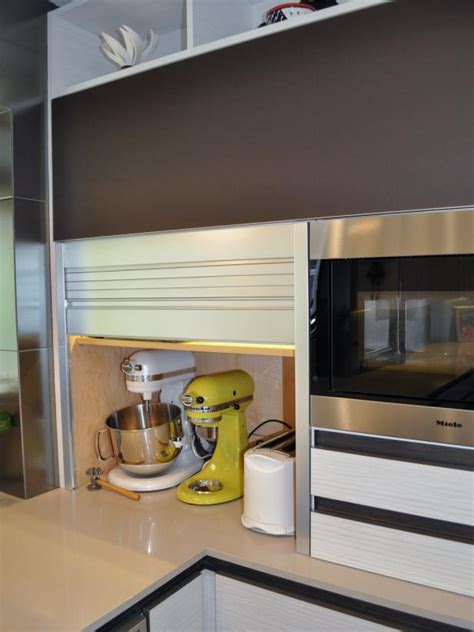 This modern kitchen necessity conveniently houses blenders, toasters, coffee machines. Contemporary Aluminum Tambour Door on Appliance Garage | HGTV