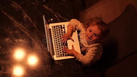 Overhead View Of A Cute Funny Little Girl Pretending To Work On The
