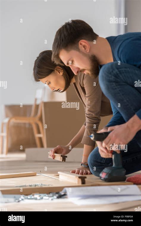 Couple Putting Together Furniture Hi Res Stock Photography And Images