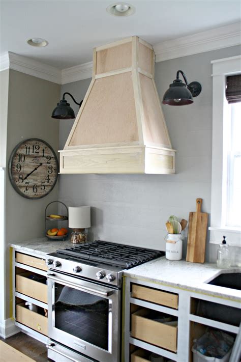 Wood range hood covers are quite popular, especially in farmhouse homes. A DIY(ish) Wood Vent Hood from Thrifty Decor Chick