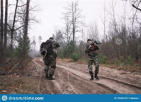 Russian Military Patrolling The Forest As Part Of A Military Operation