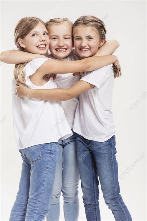 Three Girls Posing With Arms Around Each Other Stock Image F021