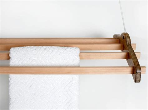 Pull your rack down, hang your clothes, rise it up send it up back again and youll save your space wood dowels are covered with water resistant special varnish. Ceiling Mounted Drying Rack - IPPINKA