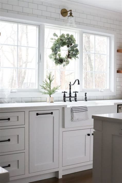The rta store's aspen white shaker kitchen cabinet collection offers a fresh, crisp, and clean look to any kitchen. Built in trashcan on one side of sink, dishwasher on the ...