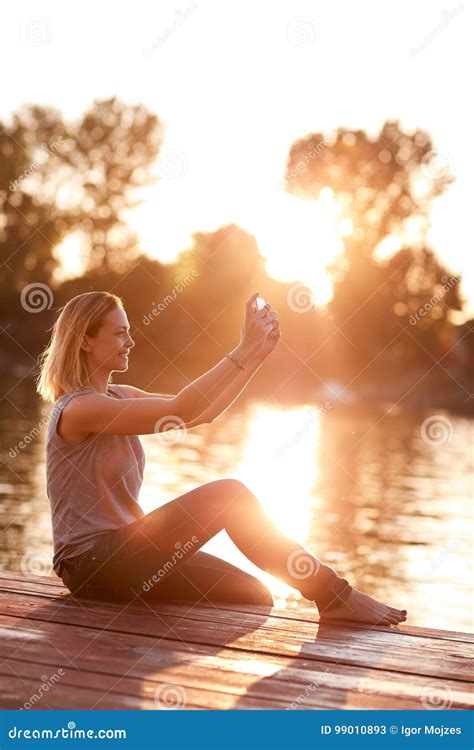 Selfie On Dock Near River At Sunset Stock Image Image Of Reflection Lake 99010893