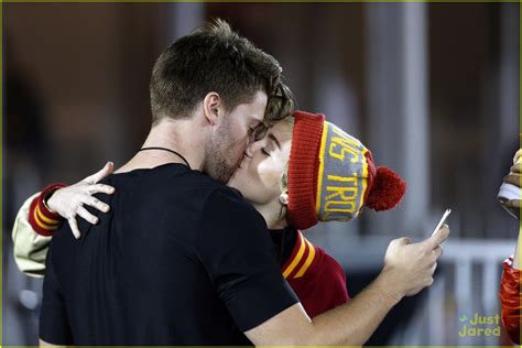 Miley Cyrus Patrick Schwarzenegger Kiss At USC Football Game See The Pics Photo
