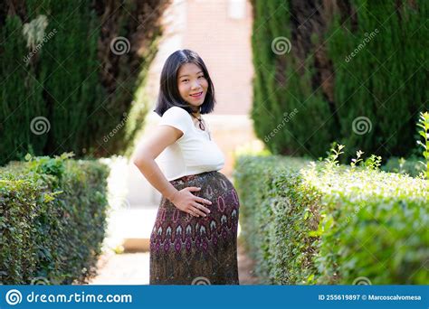 Young Happy And Beautiful Asian Japanese Woman Posing Outdoors Happy And Cheerful At City Park