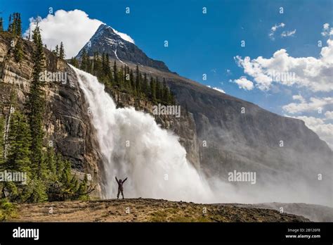 Hiker In Front Of Emperor Falls Along The Robson River In Mount Robson