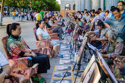 Portrait Street Painters In China Harbin With One Western Looking At