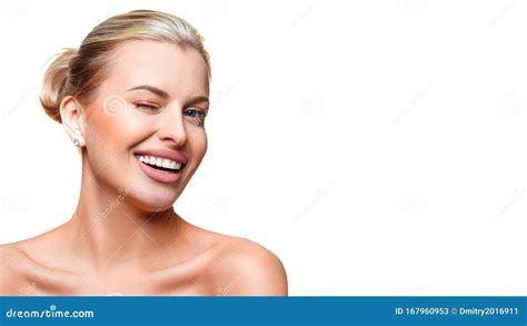 Portrait Of A Young Woman With Clear Fresh Skin Winking Isolated On