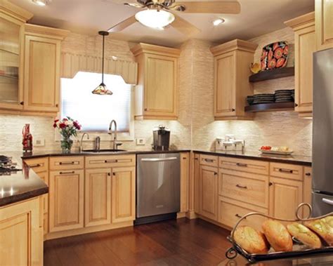 Maple caramel kitchen cabinets mendota door style cliqstudios. This small kitchen is designed to look larger with Hard Maple cabinets with a Natura… | Kitchen ...
