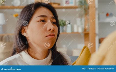 Sad Young Asian Woman Hug Cuddle Embracing With Best Friend In Living