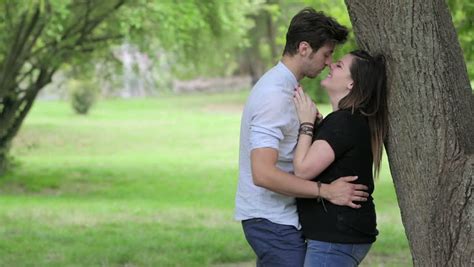 Two Lovers Are Kissing In The Park Kisses Hugs Love Stock Footage