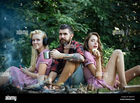 Leisure Concept Happy Friends Sitting Next To Campfire Blond Woman