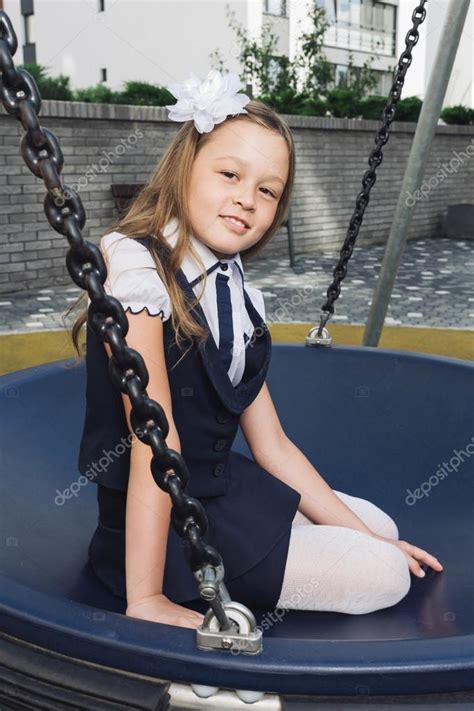 Cute Elementary Schoolgirl In Uniform At Playground ⬇ Stock Photo