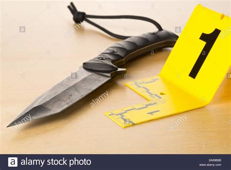 Crime Scene Investigation Csi Evidence Marker With Knife On Wooden
