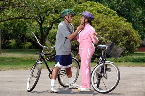 file couple preparing for bike ride