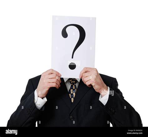 Anonymous Businessman Holding A Question Mark In Front Of His Face