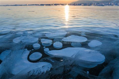 Gas Methane Bubbles Frozen In Blue Ice Of Lake Baikal Stock Photo