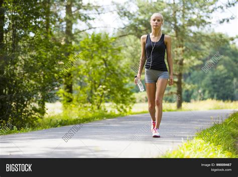 Young Woman Walks Image And Photo Free Trial Bigstock