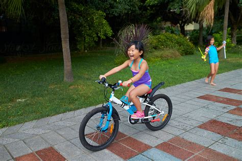 Little Asian Girl Riding Bike Outdoor By Bo Bo