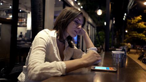 Sad Impatient Woman Waiting In Cafe At Night Stock Footage SBV