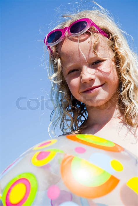 A Caucasian Girl Holding A Summer Beach Ball Stock Image Colourbox