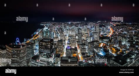 Panoramic Aerial View Of Seattle Downtown Skyline At Night With Modern