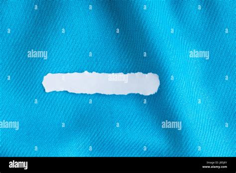 Blank Copy Space Scrap Of Paper On Blue Background Cloth Wavy Folds Of