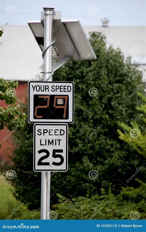 radar speed limit indicator sign showing a passing car is speeding as it drives down the road