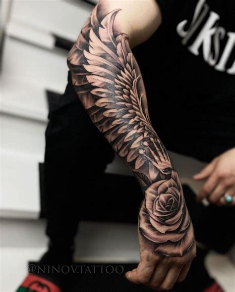 35 Breathtaking Wings Tattoo Designs Art And Design Hand Tattoos For Guys Wing Tattoo Men